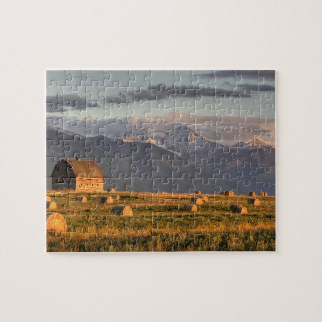 Old barn framed by hay bales and dramatic jigsaw puzzle (Horizontal)