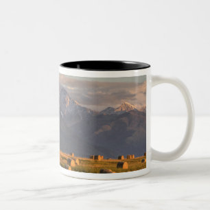 Old barn framed by hay bales and dramatic Two-Tone coffee mug