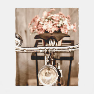 Old bicycle and flowers blur in background process fleece blanket
