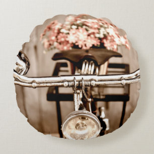 Old bicycle and flowers blur in background process round cushion
