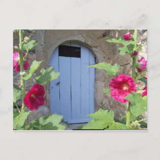 Old blue door with honeysucle postcard