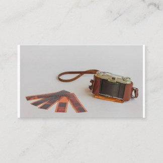 old camera with negative on   business card