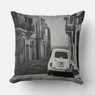 Old car in a street in Italy in black and white Cushion