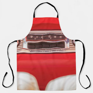 Old car radio inside a red classic American car wi Apron