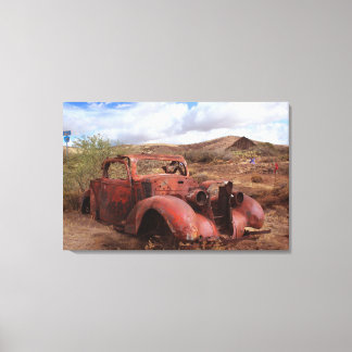 Old Car Rusting In Desert Landscape Canvas Print