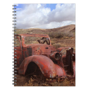 Old Car Rusting In Desert Landscape Notebook