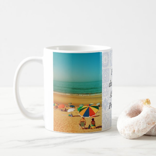 Old couple under beach umbrella in Fonte da Telha. Coffee Mug (With Donut)
