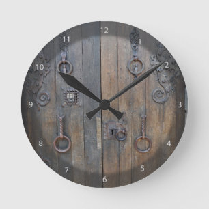 Old Decorative Wooden Door On Stone Wall Round Clock