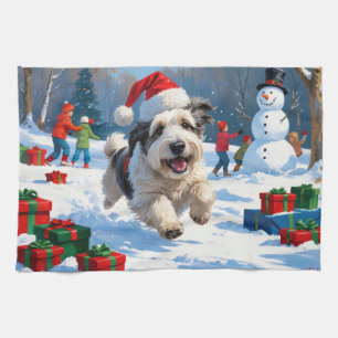 Old English Sheepdog Running in Snow Christmas Hat Tea Towel