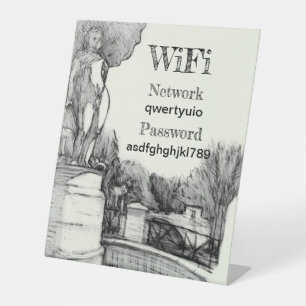 Old fountain in the park with sculpture boy pedestal sign