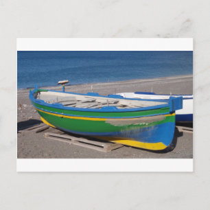 Old green fishing boat on beach. postcard
