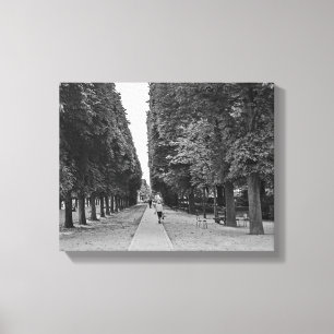 Old lady walking at park in Paris in summer Canvas Print