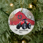 Old Red Tractor Christmas  Ceramic Ornament<br><div class="desc">A farmer's favourite red tractor is parked in front of an old red barn in the snow.</div>