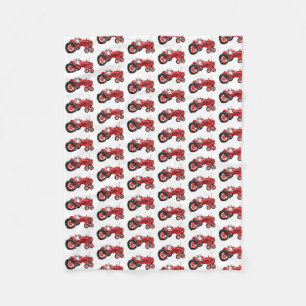 Old red tractor drawing fleece blanket