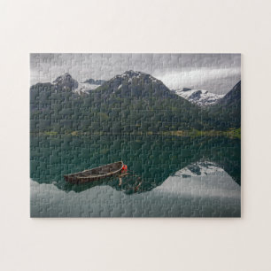 Old rowboat with mountain reflection puzzle