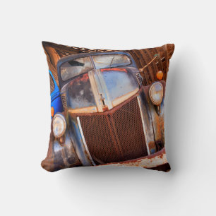 Old rusty truck on a farm cushion