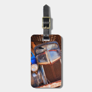 Old rusty truck on a farm luggage tag