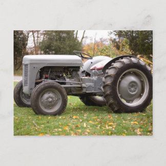 Old tractor in fall postcard