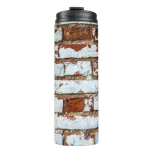 Old vintage brick wall with sprinkled white plaste thermal tumbler