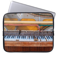 Old vintage piano with the lid off. A dilapidated
