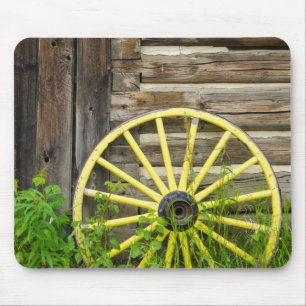 Old wagon wheel in historic old gold town mouse mat