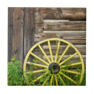 Old wagon wheel in historic old gold town tile