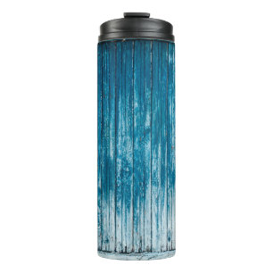 Old weathered grunge wooden faded pale blue paint thermal tumbler