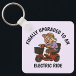 Old Woman on Scooter Key Ring<br><div class="desc">Celebrate sass, speed, and senior style with this funny keychain featuring an old woman zooming on her mobility scooter. With unstoppable attitude, she’s clearly loving her new electric wheels. Whether you’re gifting it to a feisty grandma, a friend with a great sense of humour, or just treating yourself, this keychain...</div>