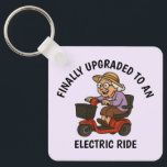 Old Woman on Scooter Key Ring<br><div class="desc">Celebrate sass, speed, and senior style with this funny keychain featuring an old woman zooming on her mobility scooter. With unstoppable attitude, she’s clearly loving her new electric wheels. Whether you’re gifting it to a feisty grandma, a friend with a great sense of humour, or just treating yourself, this keychain...</div>