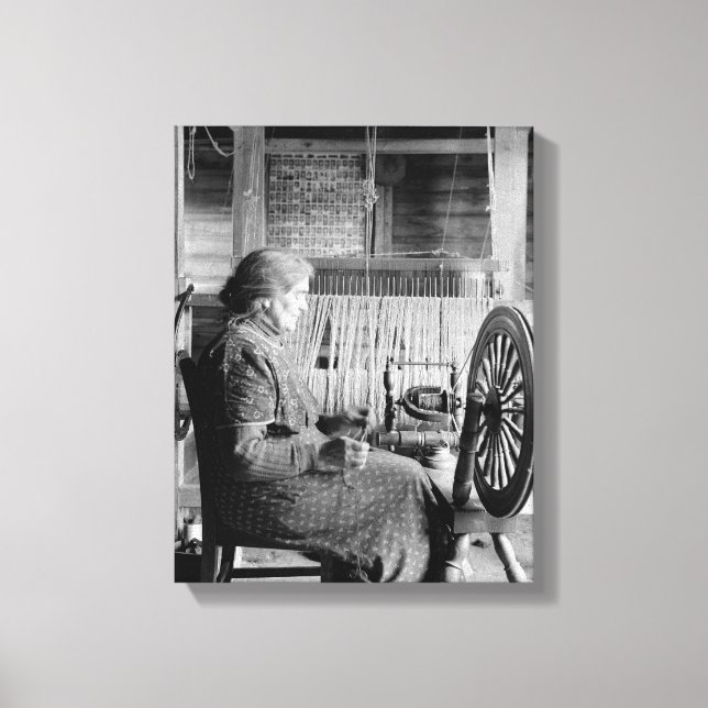 oLD wOMAN uSING sPINNING wHEEL 1930S PHOTOGRAPH Canvas Print (Front)
