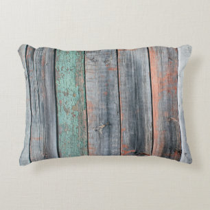 Old wooden fence painted in different color, trend decorative cushion