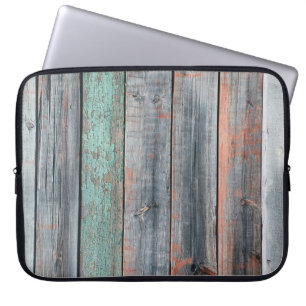 Old wooden fence painted in different colour, tren laptop sleeve
