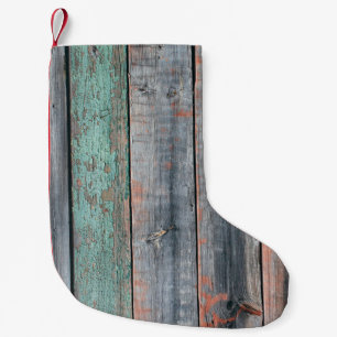 Old wooden fence painted in different colour, tren small christmas stocking