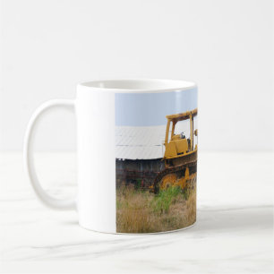 Old Yellow Bulldozer Parked In A Pasture Coffee Mug