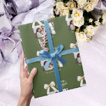 Olive green cream bow photo script Christmas Wrapping Paper<br><div class="desc">A muted olive green background,  cream coloured text and a bow. Text and photo.  Merry Christmas is written with an elegant hand-lettered style font. 
Personalise and add your family name.</div>