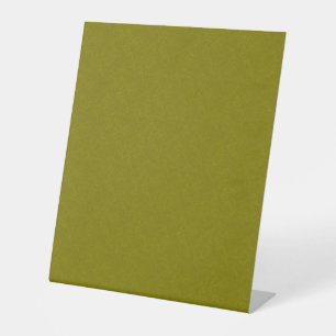 Olive green surface with subtle swirling pattern pedestal sign