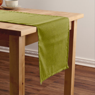 Olive green surface with subtle swirling pattern short table runner