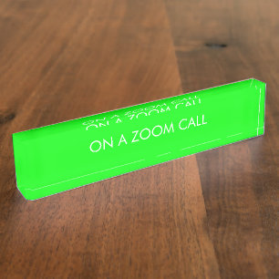 On a zoom call neon green personalised custom text nameplate