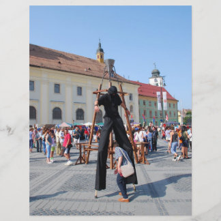 On stilts in a festival flyer