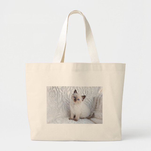 One young ragdoll cat sitting on fur in chair large tote bag (Front)