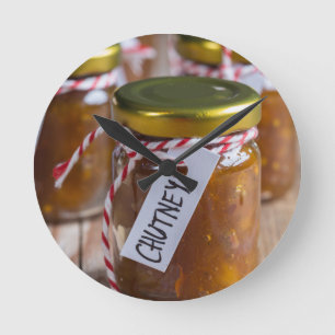 Onion pineapple chutney on rustic wood round clock