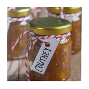 Onion pineapple chutney on rustic wood tile