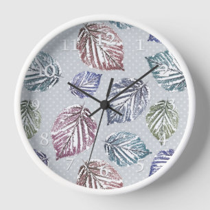 Openwork leaves on a light grey background clock