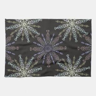 Openwork snowflakes on dark. tea towel