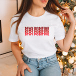 Optimism-Boosting Stay Positive Shirt<br><div class="desc">Embrace the power of positivity with this Love-Infused Stay Positive Tee. Featuring the vibrant "Stay Positive" message in bold red, this shirt is not just a piece of clothing, but a spiritual reminder to always choose optimism. Spread love and positivity wherever you go with this trendy and meaningful lifestyle tee....</div>