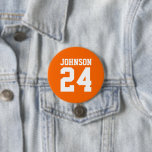 Orange and White Athlete Name Jersey Number 7.5 Cm Round Badge<br><div class="desc">Cheer on your favourite sports team, football player or just show off your school pride with a custom personalised spirit button! Add your school name or personalise with a player's name and jersey number. Perfect for football, basketball, baseball and soccer games! Create custom pins for the whole team, cheerleaders, parents...</div>