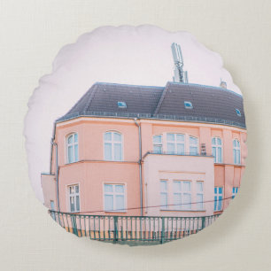 ORANGE AND WHITE CONCRETE BUILDING ROUND CUSHION