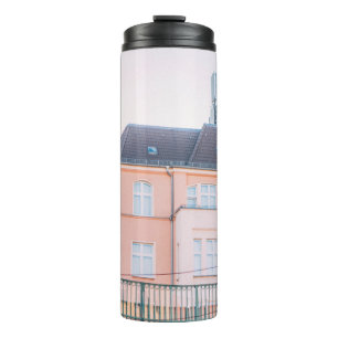ORANGE AND WHITE CONCRETE BUILDING THERMAL TUMBLER