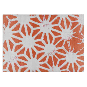 Orange and white geometric pattern cutting board