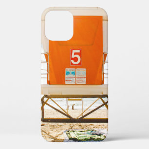 Orange and white shed in front of shore iPhone 12 case